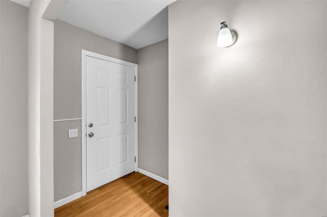 entryway with wood-type flooring