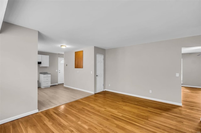 spare room featuring light hardwood / wood-style flooring