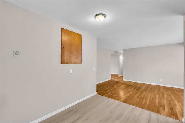 unfurnished room featuring light wood-type flooring