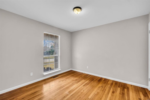 spare room featuring hardwood / wood-style floors