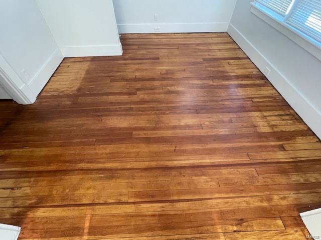 interior details featuring hardwood / wood-style flooring