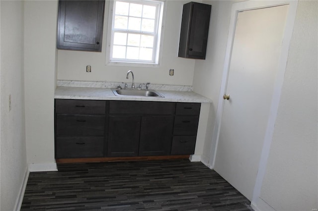 kitchen featuring dark hardwood / wood-style flooring and sink