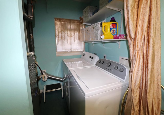 washroom featuring washing machine and dryer