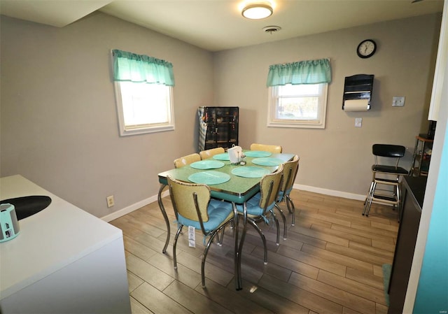 dining room with hardwood / wood-style floors