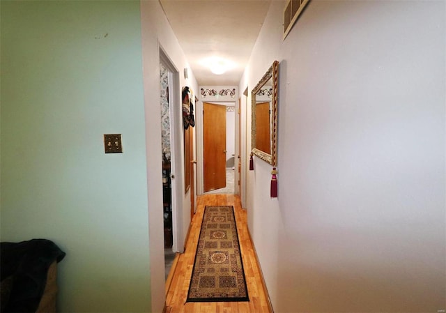 hallway featuring light hardwood / wood-style flooring