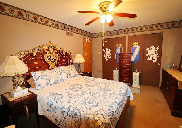 bedroom with carpet, ceiling fan, and a closet