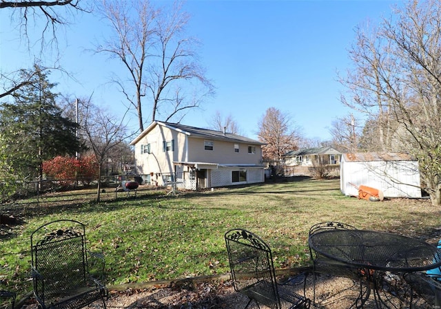 view of yard with a fire pit and a storage shed