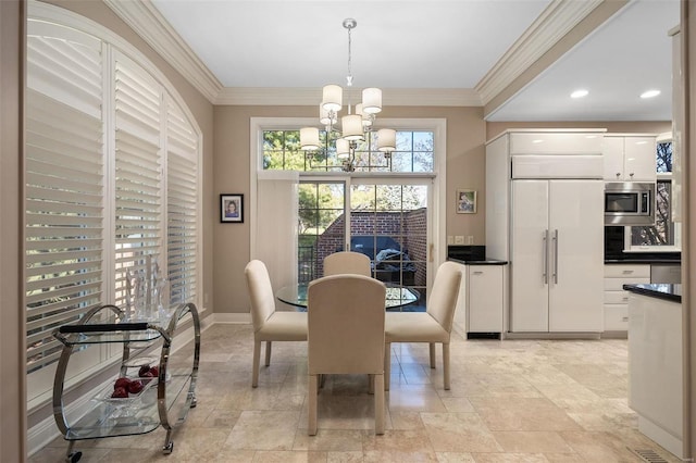 dining area featuring a chandelier and ornamental molding