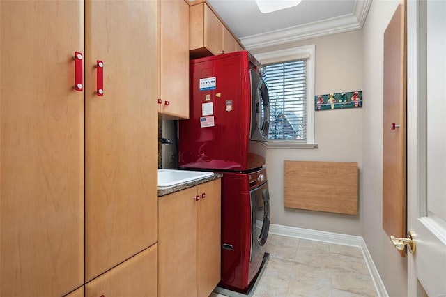 clothes washing area featuring cabinets, ornamental molding, and stacked washer and dryer