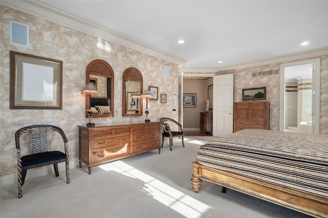 carpeted bedroom featuring ensuite bathroom and crown molding