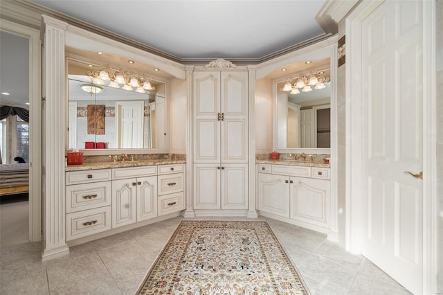 bathroom featuring tile patterned floors, vanity, and ornamental molding