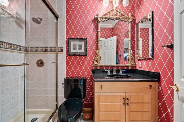 bathroom with vanity and a shower with shower door