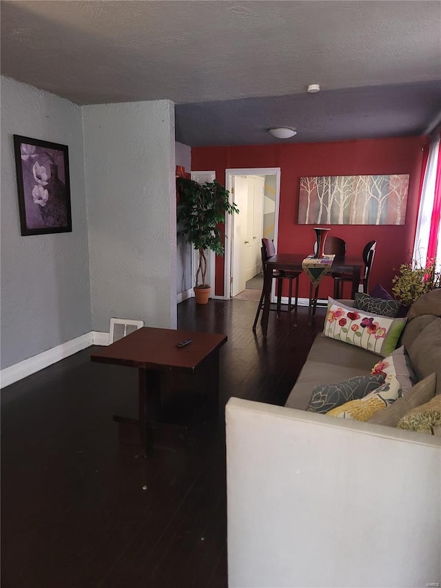 living room with dark hardwood / wood-style floors