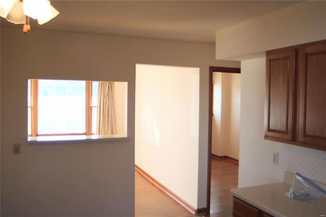 interior space with light hardwood / wood-style flooring and ceiling fan