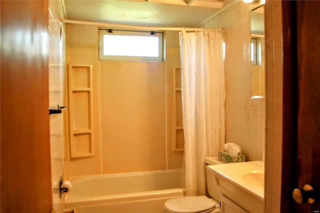 full bathroom featuring shower / tub combo with curtain, vanity, and toilet