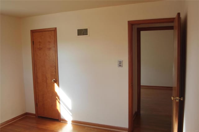 spare room with dark wood-type flooring