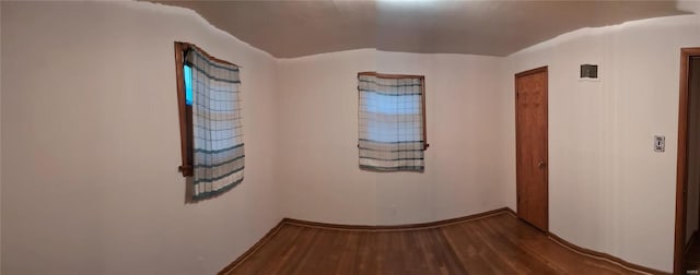 corridor featuring hardwood / wood-style floors