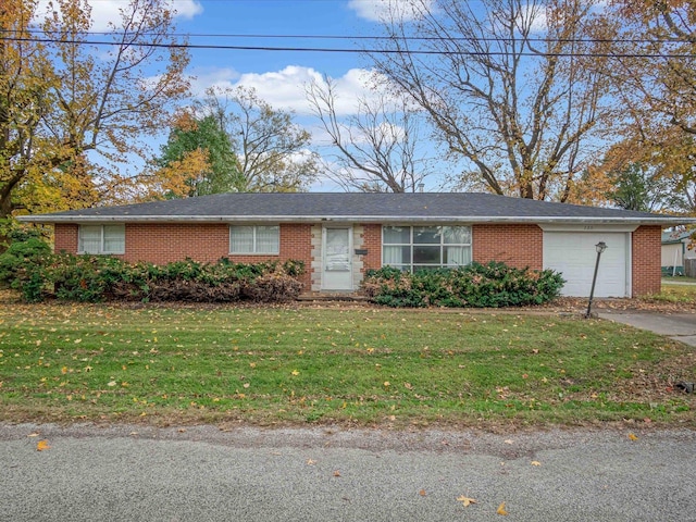 single story home featuring a front yard and a garage