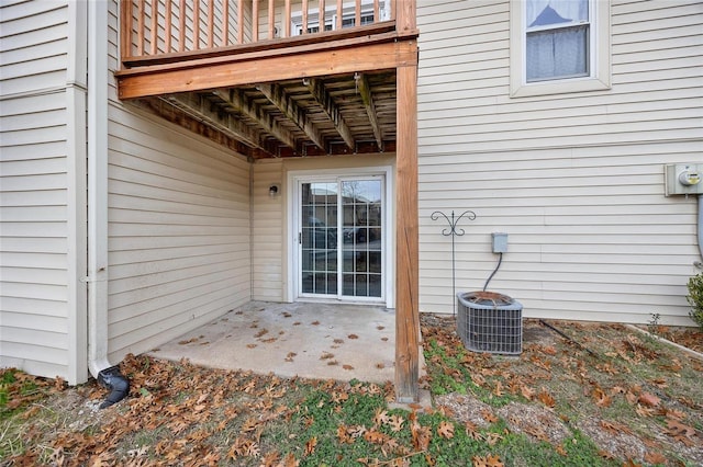 property entrance with a patio area and central AC