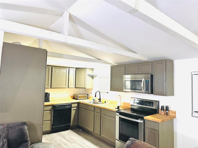 kitchen with wooden counters, sink, light hardwood / wood-style flooring, vaulted ceiling with beams, and appliances with stainless steel finishes