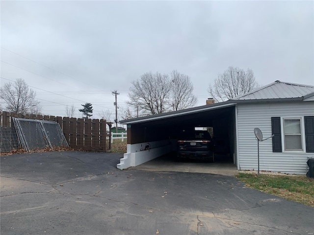 exterior space with a carport