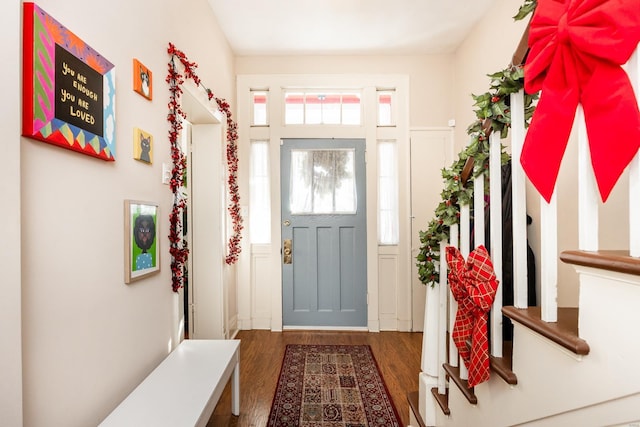 foyer with dark hardwood / wood-style floors