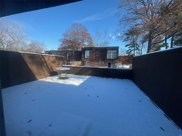 view of yard covered in snow