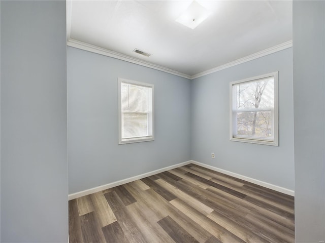 unfurnished room with wood-type flooring and ornamental molding