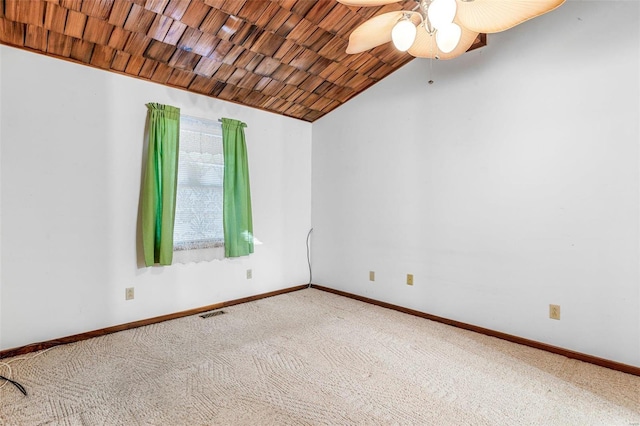 spare room with carpet, ceiling fan, lofted ceiling, and wood ceiling