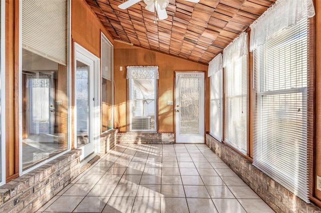 unfurnished sunroom featuring ceiling fan, lofted ceiling, and wood ceiling