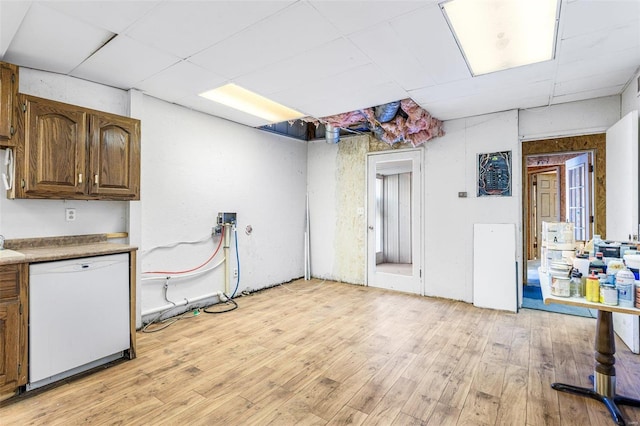 kitchen featuring white dishwasher and light hardwood / wood-style floors