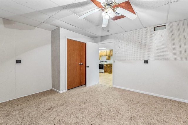 interior space featuring light colored carpet and ceiling fan