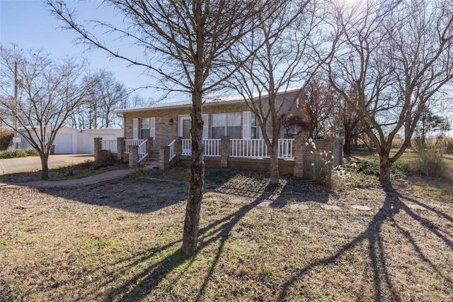 view of front of property with an outbuilding and a garage