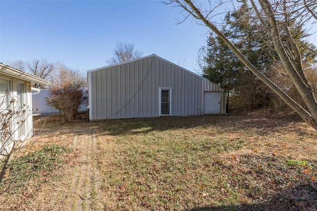 view of outbuilding with a yard