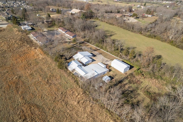 birds eye view of property with a rural view