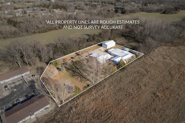 birds eye view of property featuring a rural view