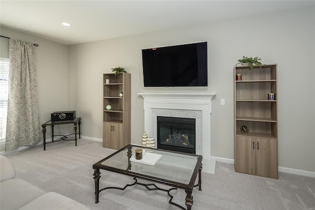 carpeted living room with a fireplace