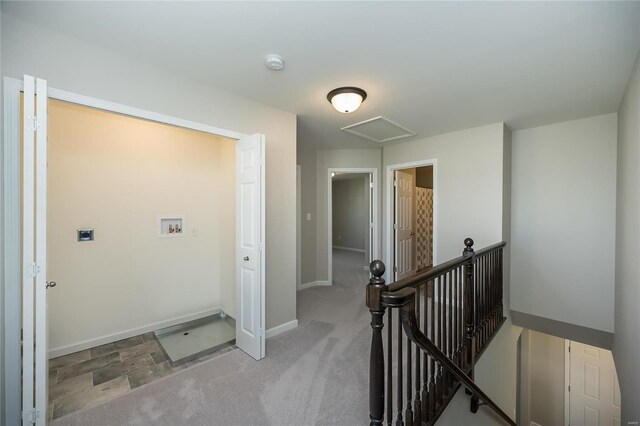 corridor with light colored carpet