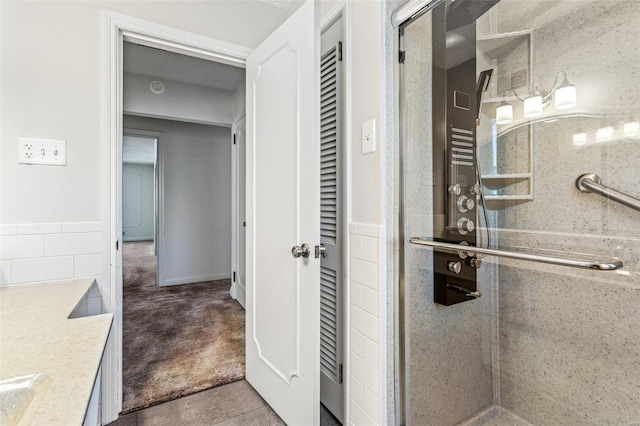 bathroom with vanity, concrete flooring, and walk in shower