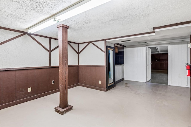 basement with a textured ceiling