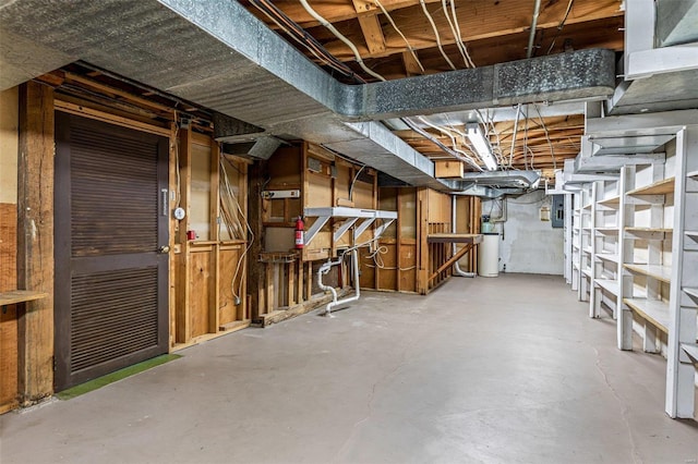 basement featuring water heater