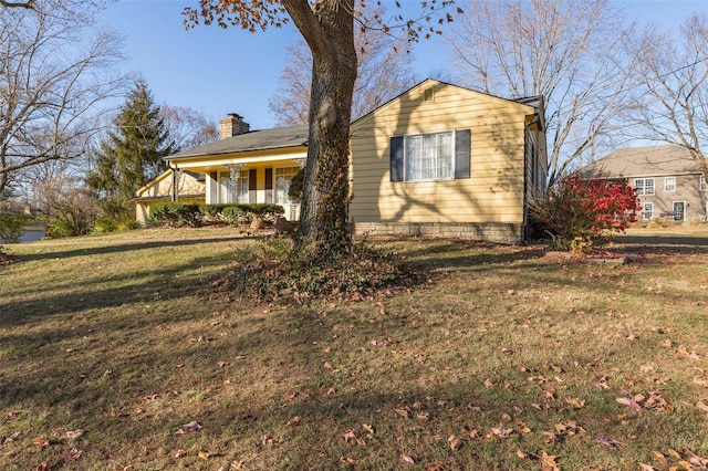 view of front of property with a front yard and a porch