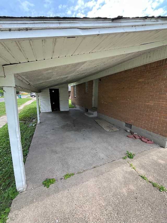 view of vehicle parking with a carport