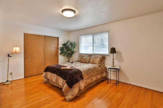 bedroom featuring a closet and light hardwood / wood-style floors