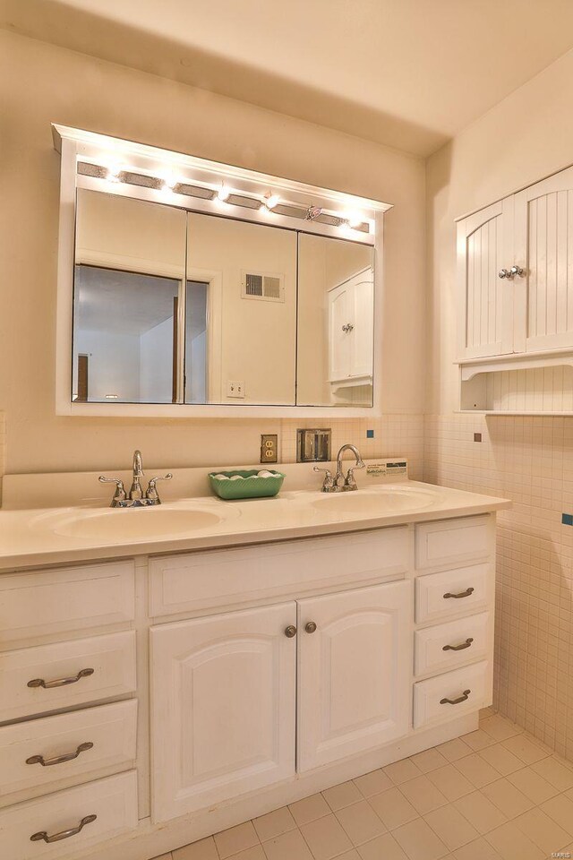 bathroom featuring tile walls and vanity