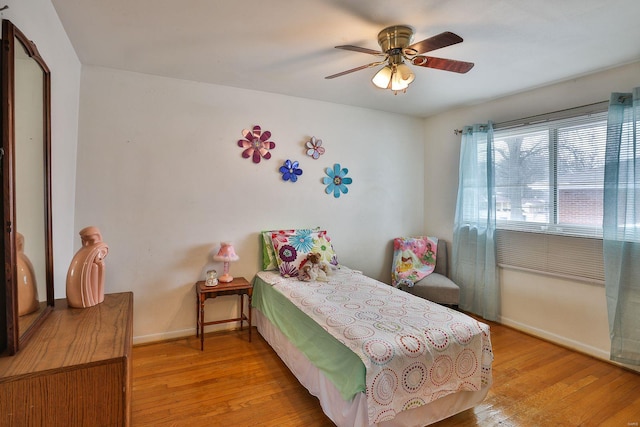 bedroom featuring ceiling fan and light hardwood / wood-style flooring