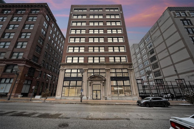 view of outdoor building at dusk