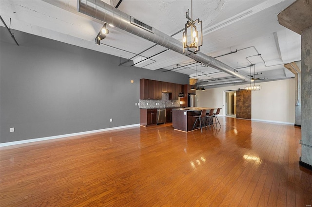 unfurnished living room featuring wood-type flooring