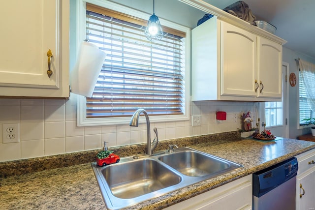 kitchen featuring white cabinets, tasteful backsplash, sink, decorative light fixtures, and dishwasher