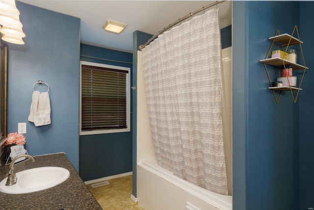 bathroom featuring tile patterned flooring, shower / bath combination with curtain, and vanity